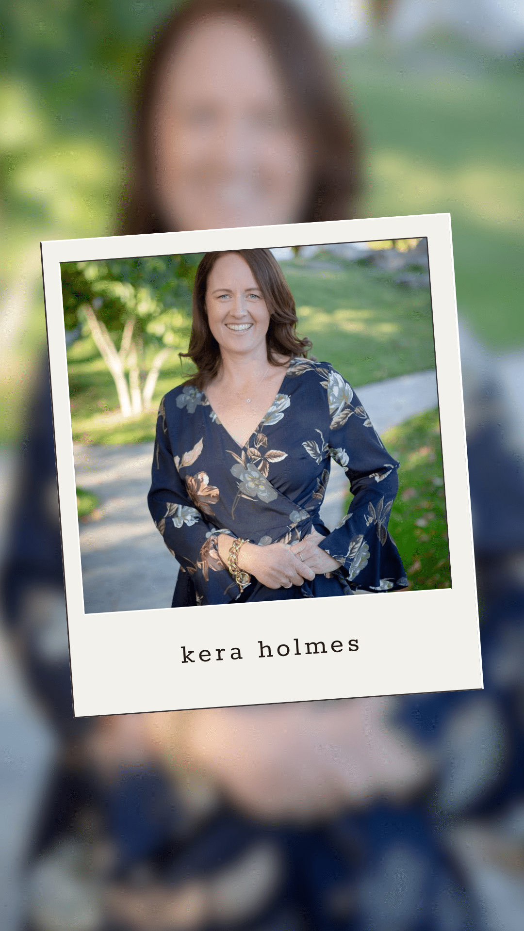 A woman with shoulder-length brown hair, wearing a blue floral dress, stands outdoors smiling. The name “kera holmes” is printed below her photo, which is styled like a Polaroid over a blurred background of the same image.